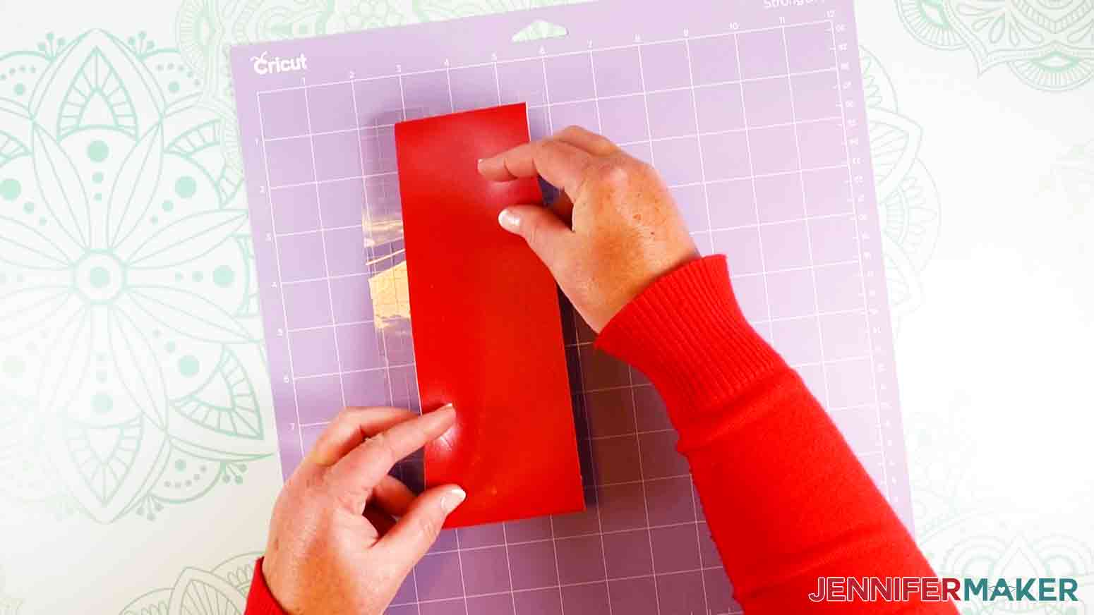 Placing leather on mat for handwriting bookmark