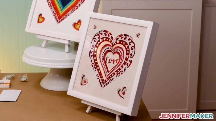 LED lights inside the layered heart svg design with a white frame