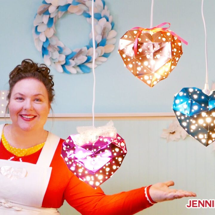 Jennifer Maker with her heart-shaped hanging paper lanterns made from metallic cardstock and Kraft board