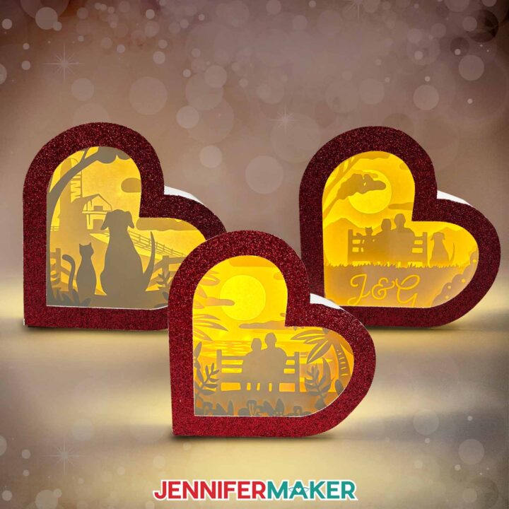 Make a Heart-Shaped Shadow Box with Jennifer Maker's tutorial! Three heart-shaped shadow boxes with red glitter frames and different designs -- one customizable!