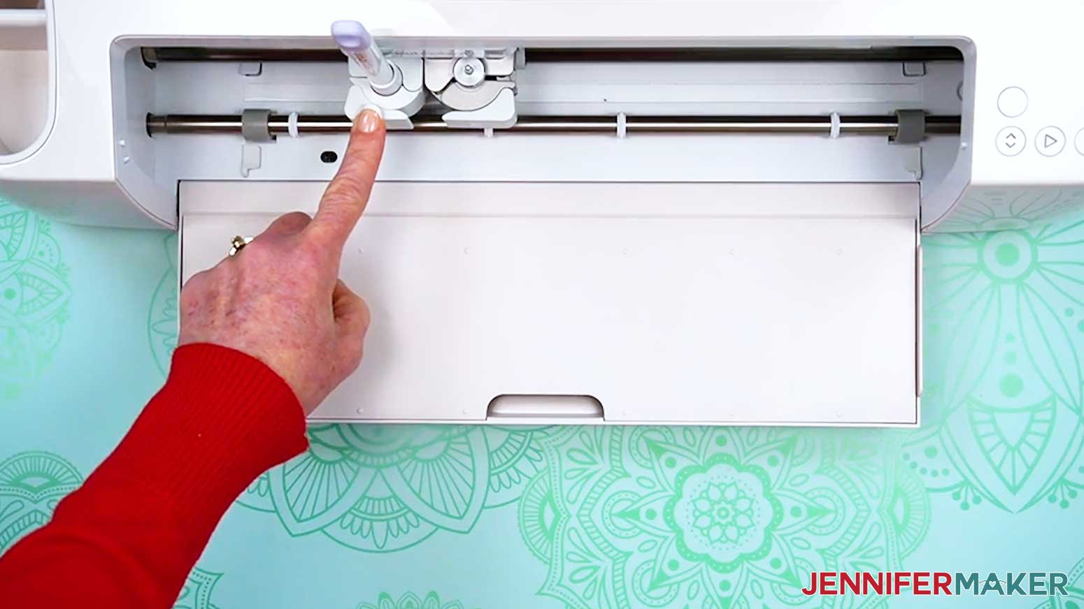 Place the scoring stylus in the clamp next to the fine point blade.