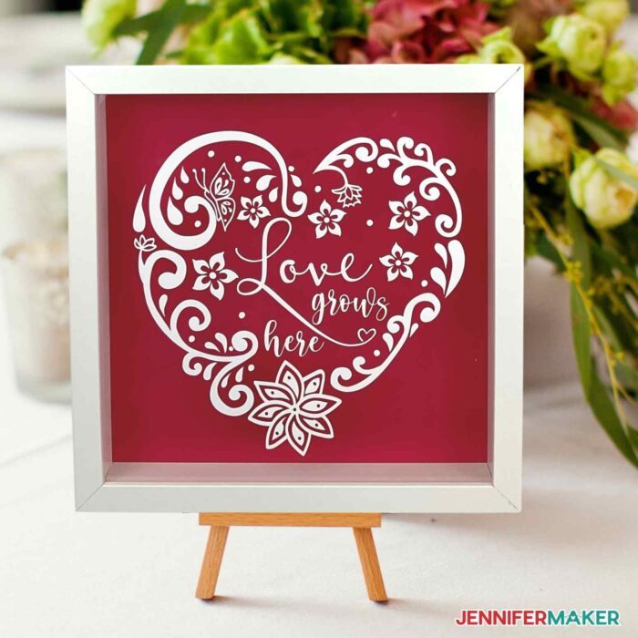 Pretty white vinyl shadowbox with a red background made with the wet vinyl transfer method