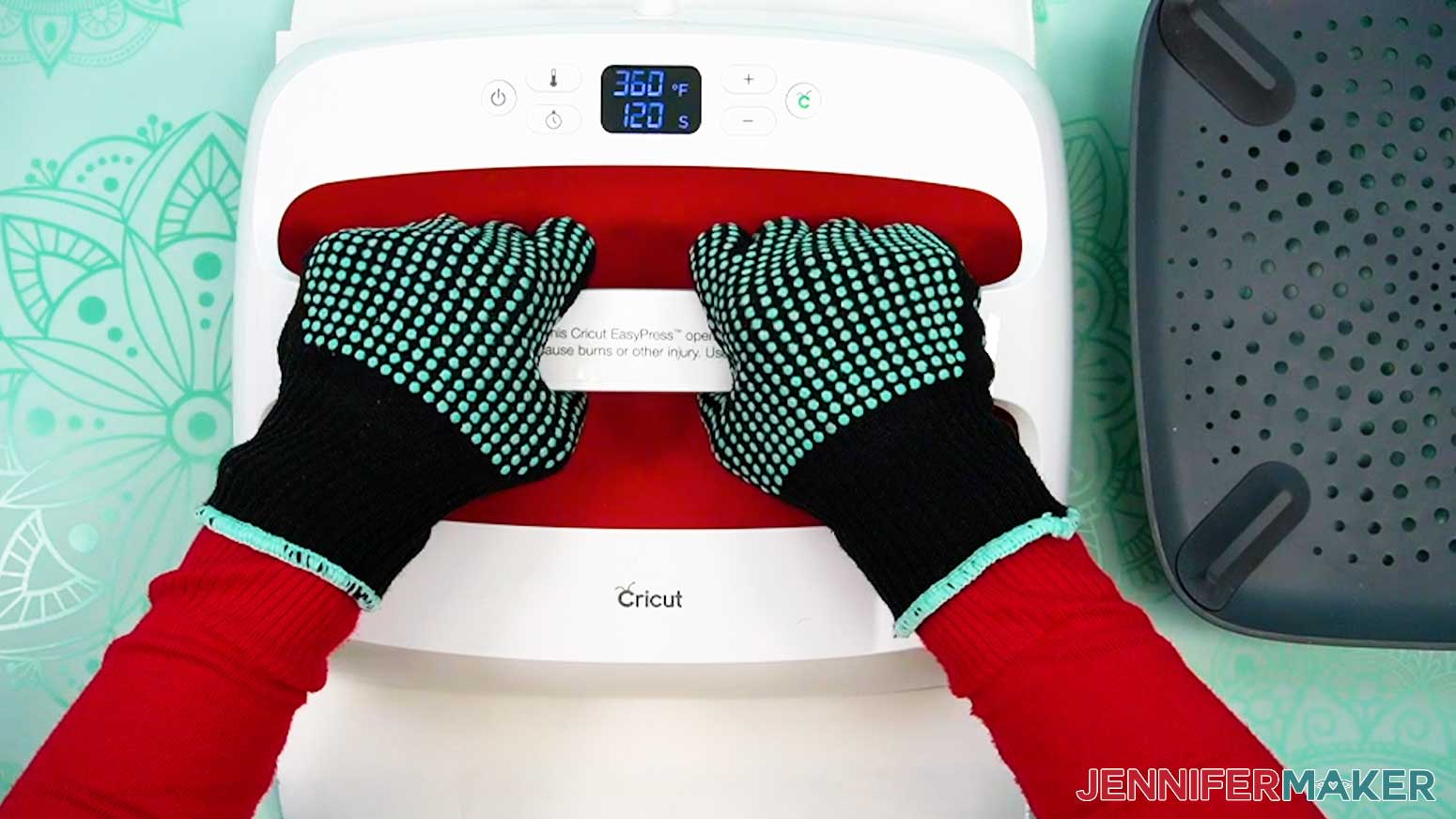 Hold the Cricut Easy Press securely with both hands to prevent the shaped wind spinner from shifting during pressing.