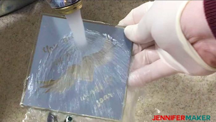 Rinsing the Armour Etch etching cream off the glass coaster with the vinyl decal - how to etch glass
