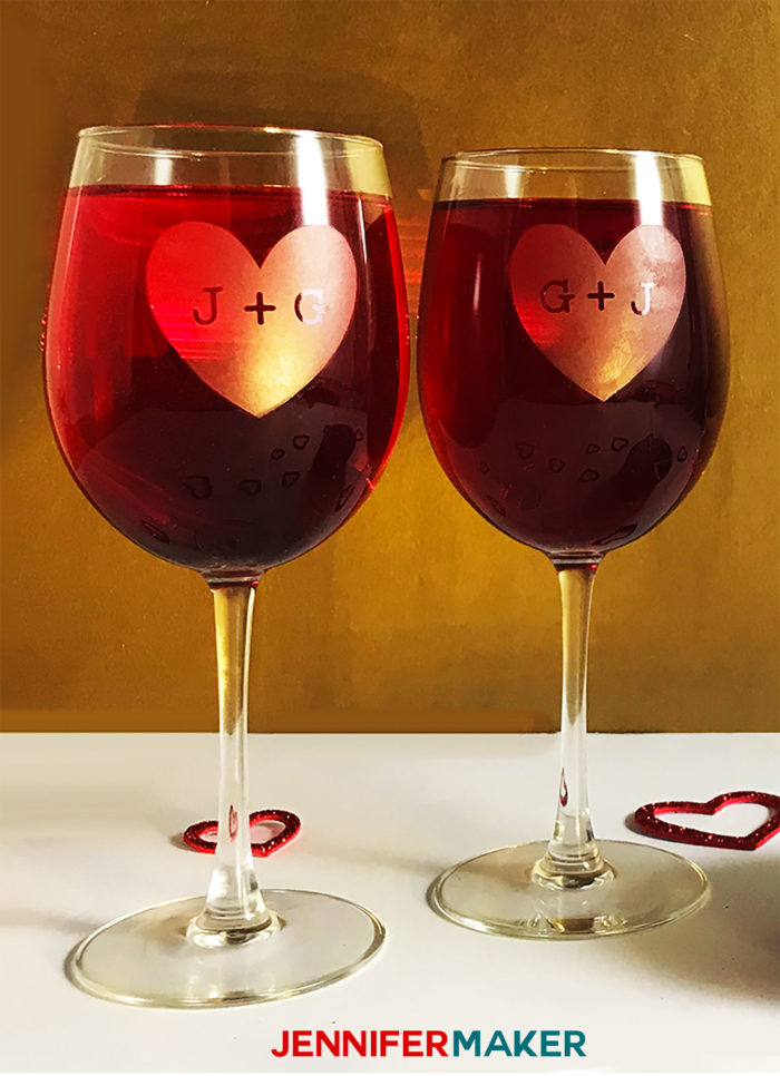 Etched wine glasses with red wine