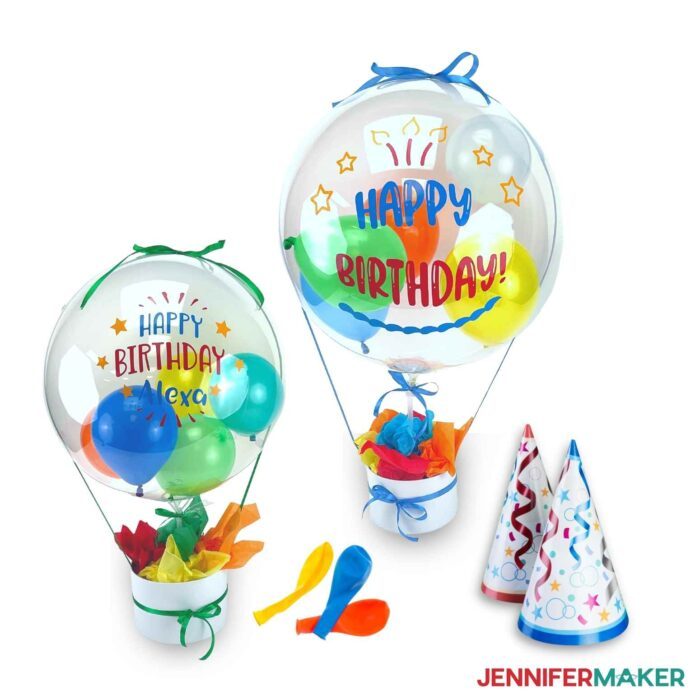 Two large, decorated balloons with smaller balloons inside with birthday themes and party hats made using the How to Make a Balloon Bouquet tutorial.