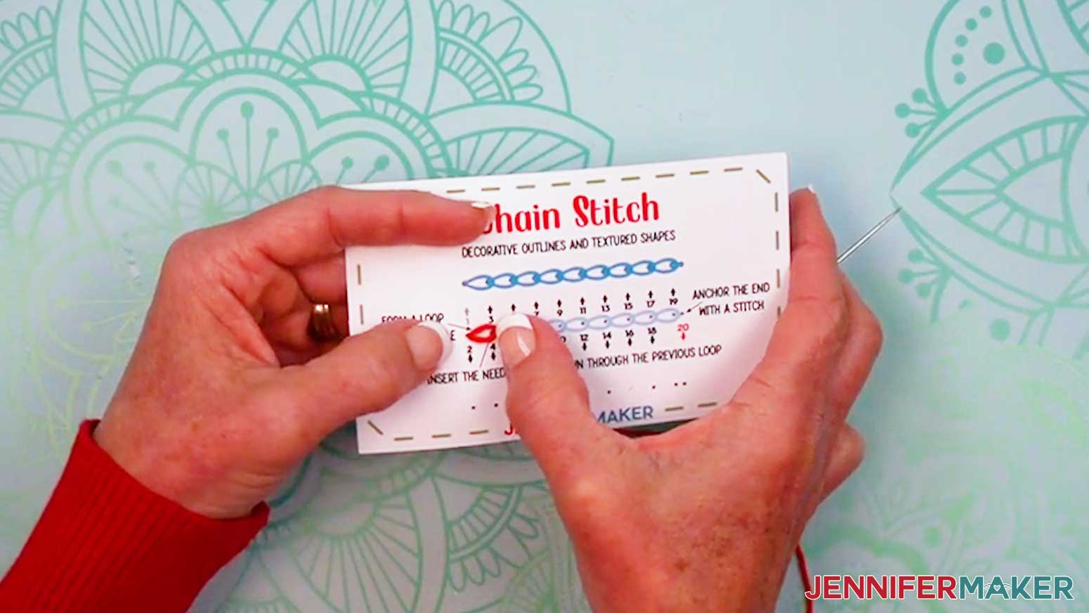 Make a loop above the first hole of the Embroidery Stitch Book Chain Stitch page.