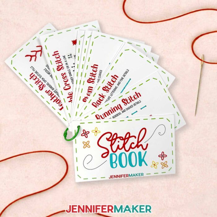 The embroidery stitch book lays flat with the individual cards spread out, held together with a green ring