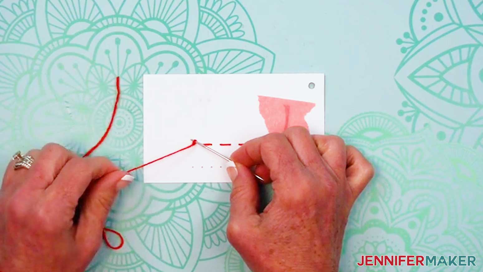 Tie a knot in the back close to the surface of the page for the Embroidery Stitch Book.