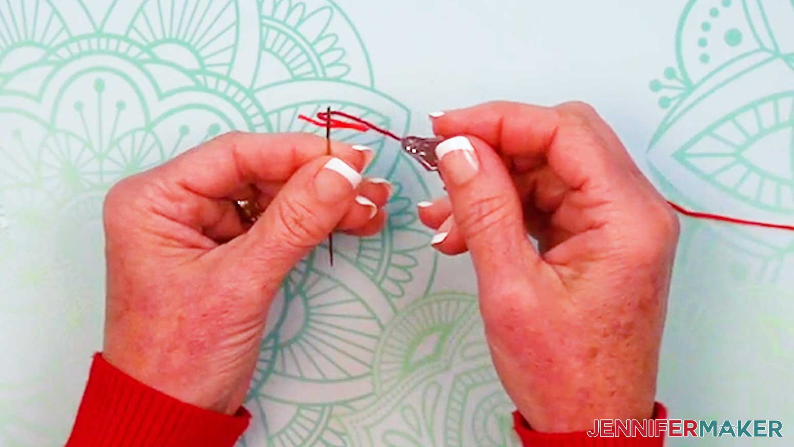 Use a needle threader to assist in placing the thread for the Embroidery Stitch Book through the eye of the needle.