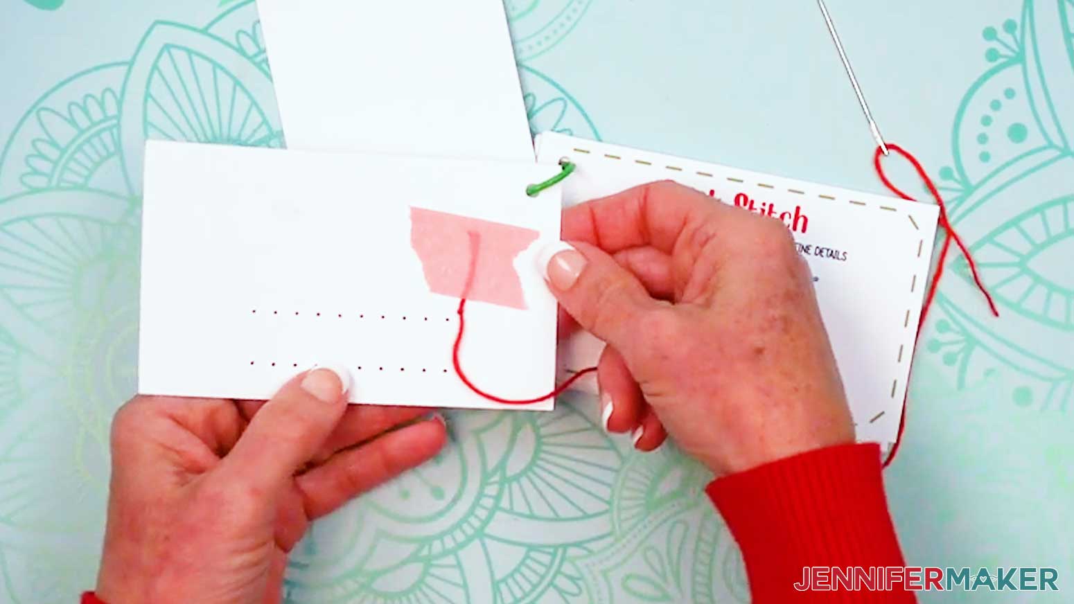 Use tape to attach the trailing threads to the back of the Embroidery Stitch Book card.