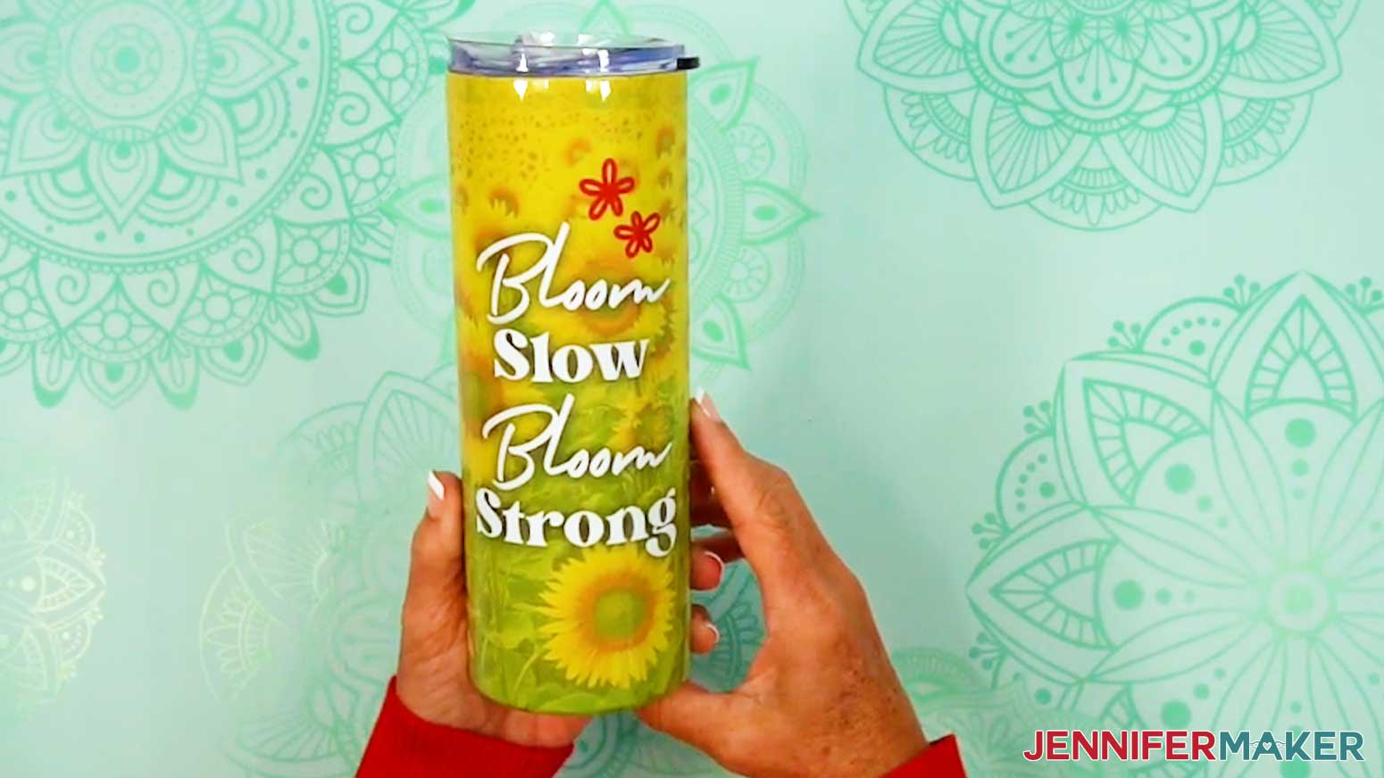 A finished 20 oz skinny tumbler with a sublimated sunflower design.