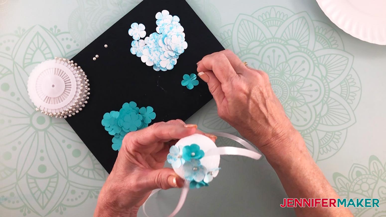 Make a paper hydrangea flower by sticking a pin into the flower