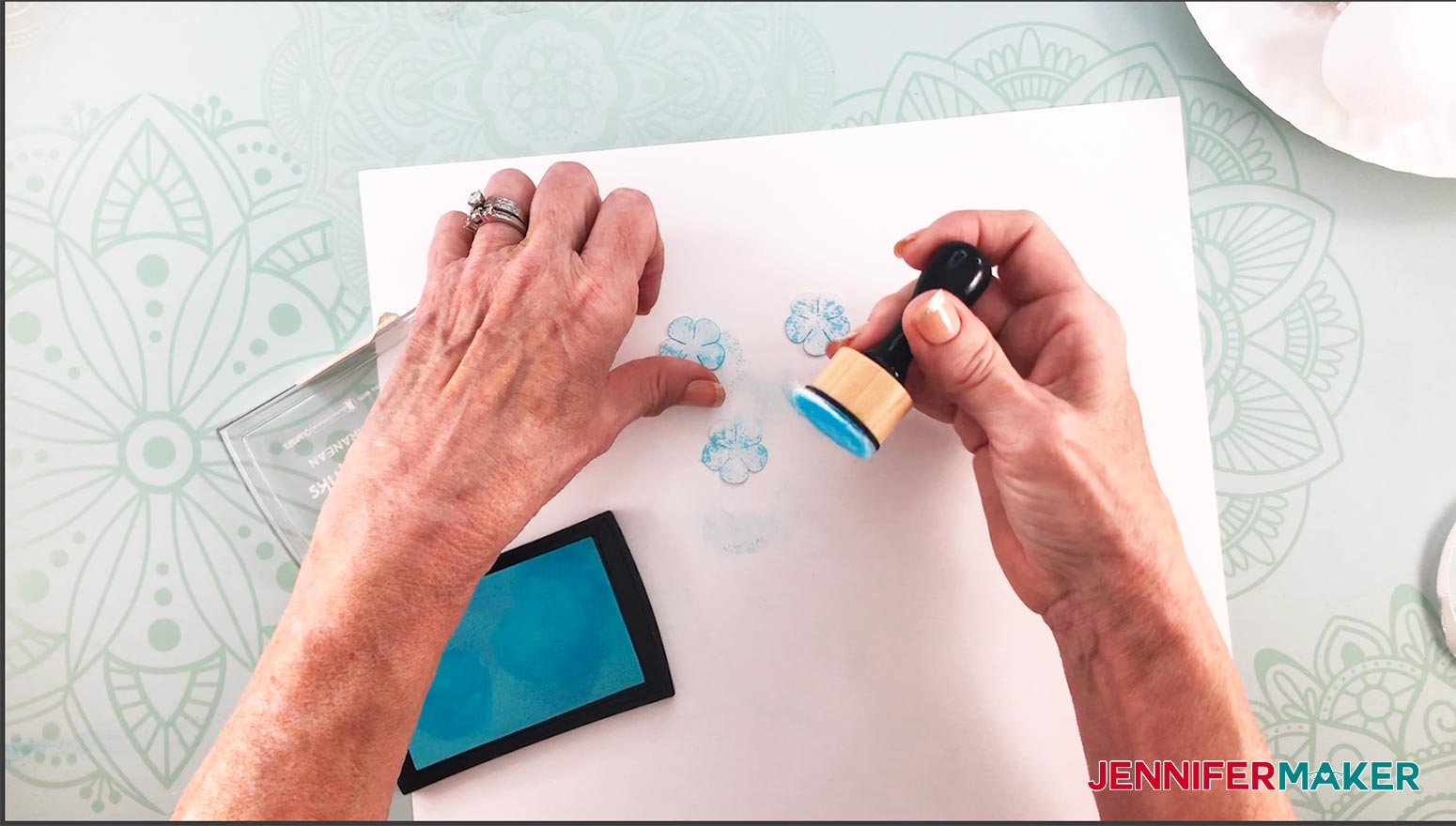 Make a paper hydrangea flower by inking the petals with stamp ink pad and ink dabber