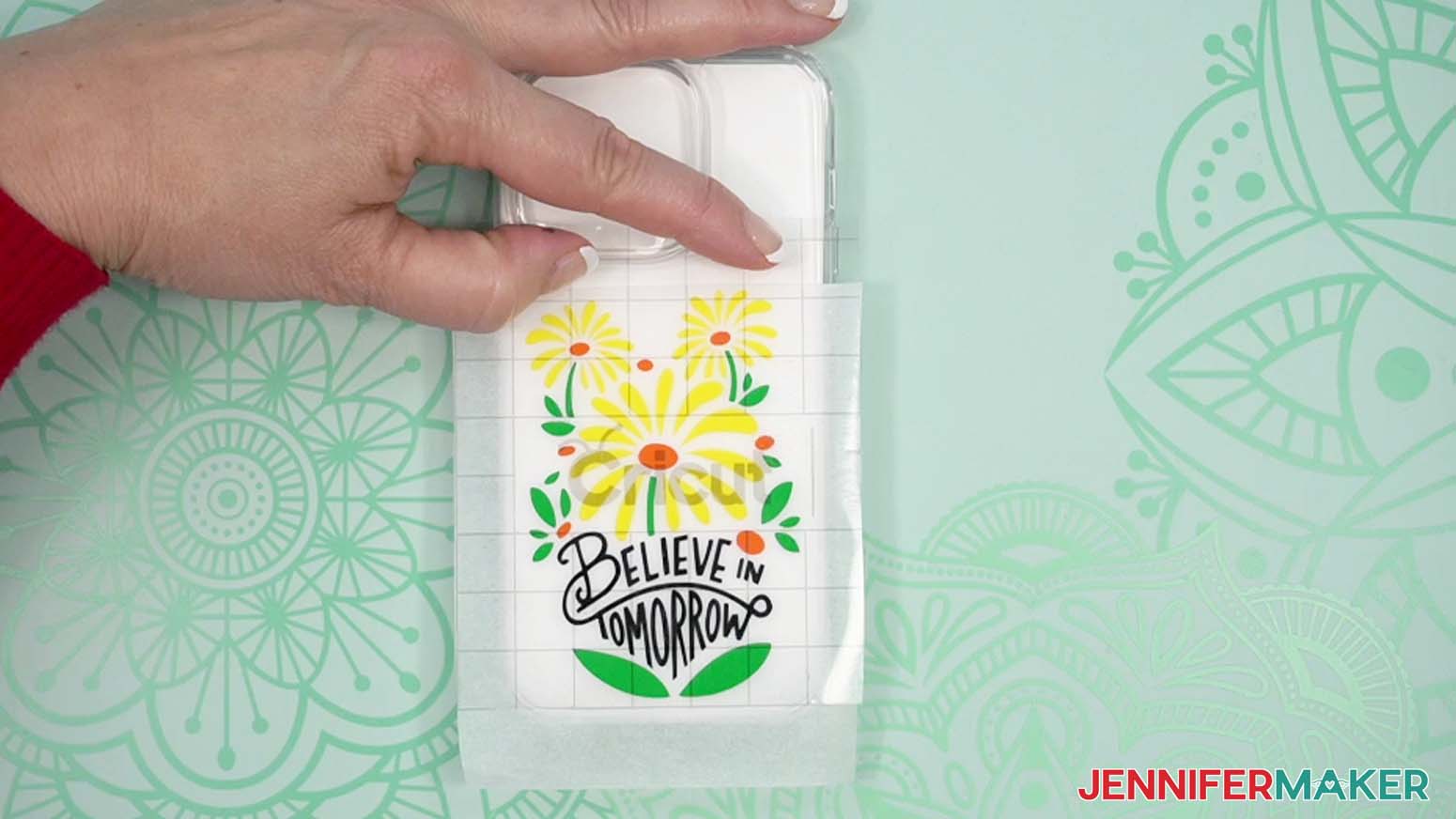Align your design on your phone case, and press down on the exposed section of transfer tape
