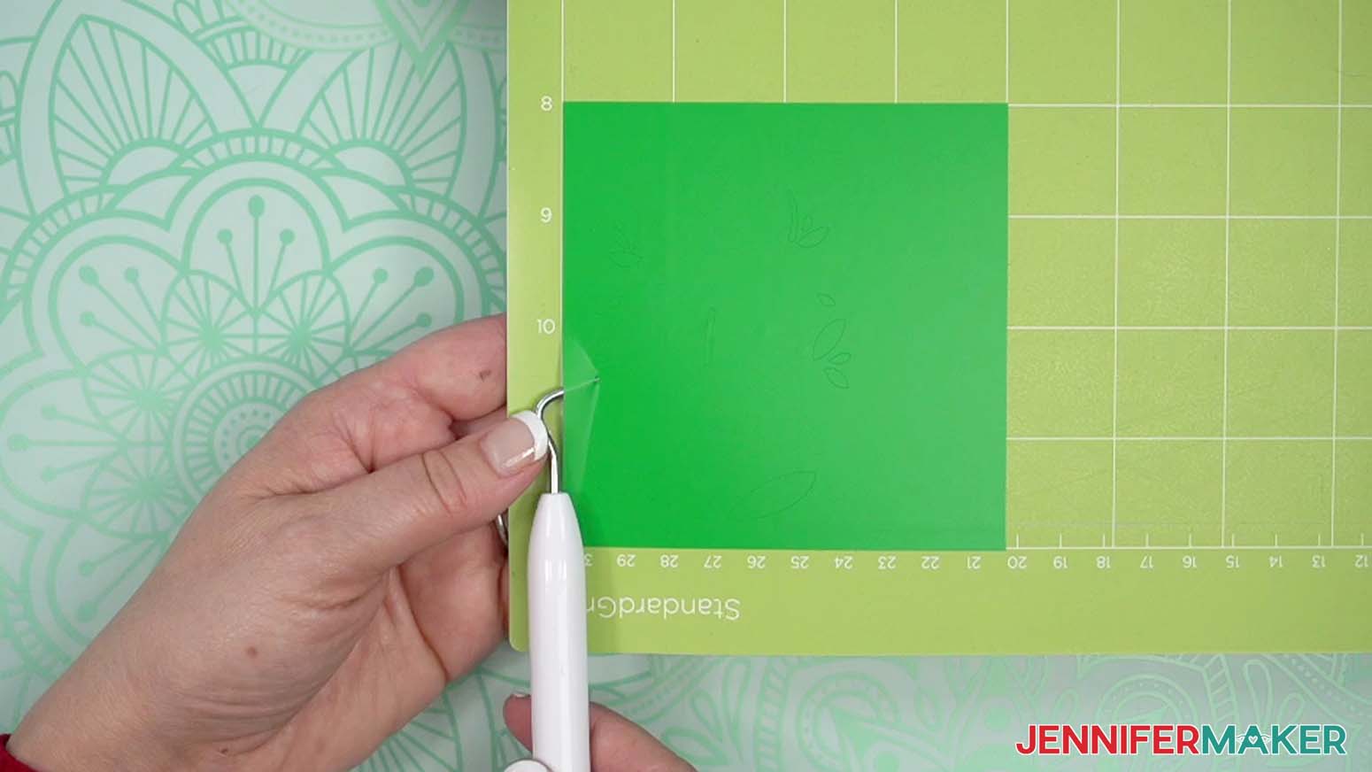 Gently lift a corner of the material to make sure the cuts went all the way through