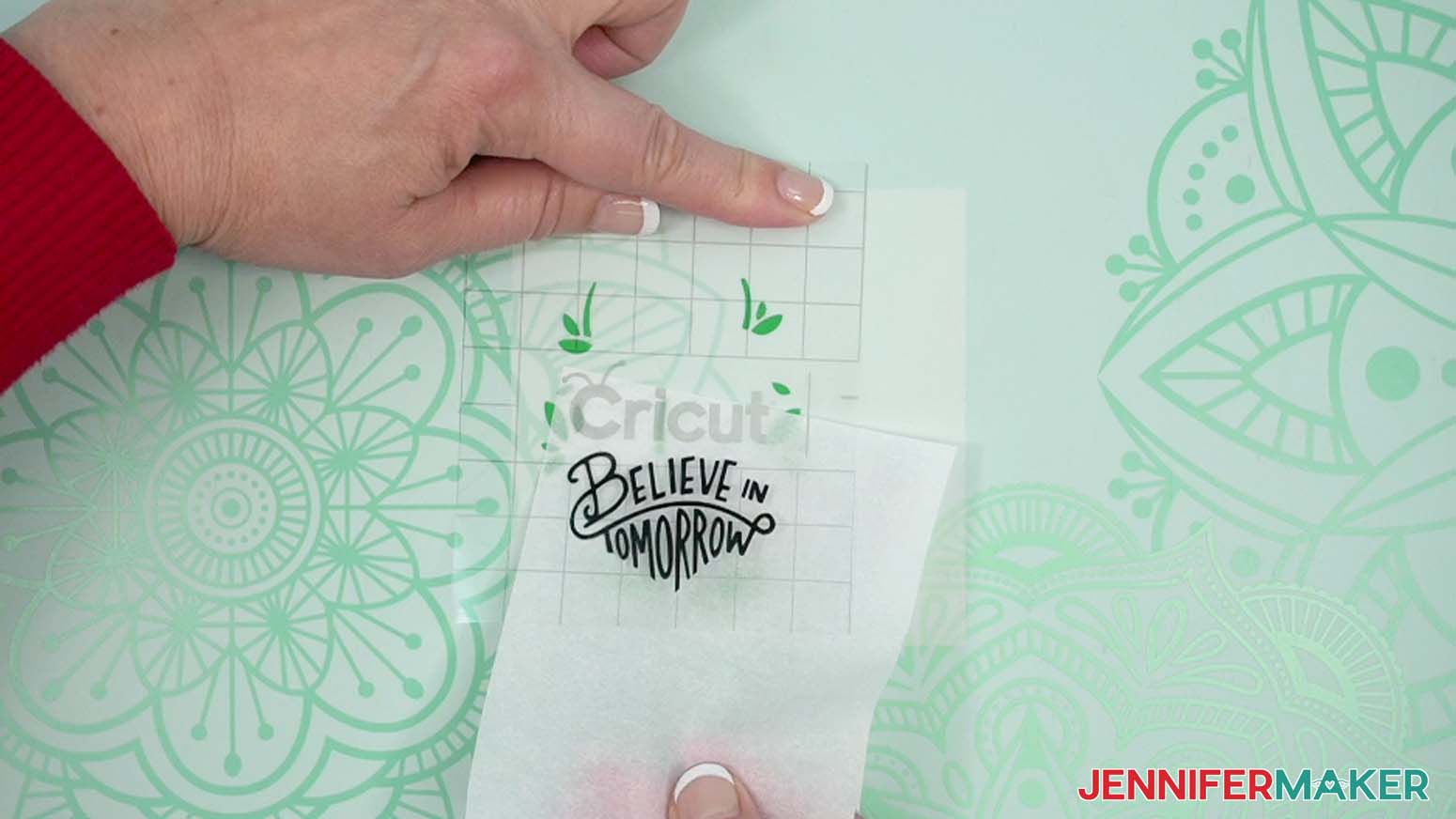 Hold the transfer tape in place and gently remove the parchment paper.