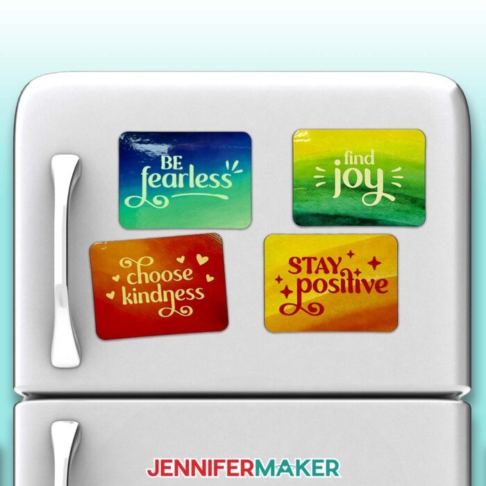 Four sublimated message magnets on a fridge: "Be fearless," "find joy," "choose kindness," and "stay positive."