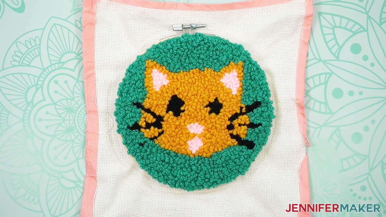 Place the hoop around the loop side of the punch needle design.