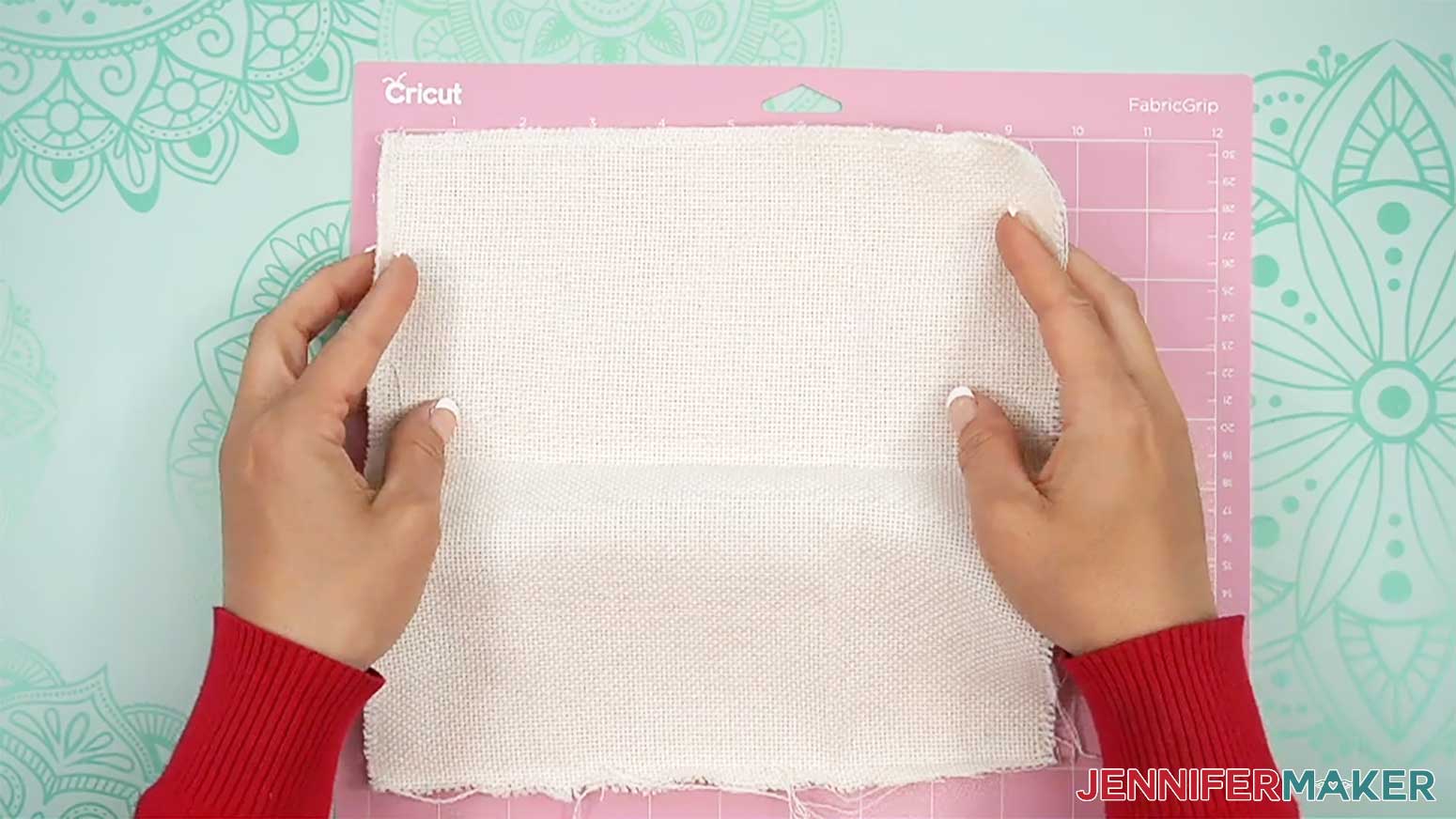 Place the fabric onto the FabricGrip machine mat to draw the punch needle design onto the fabric using the Cricut.