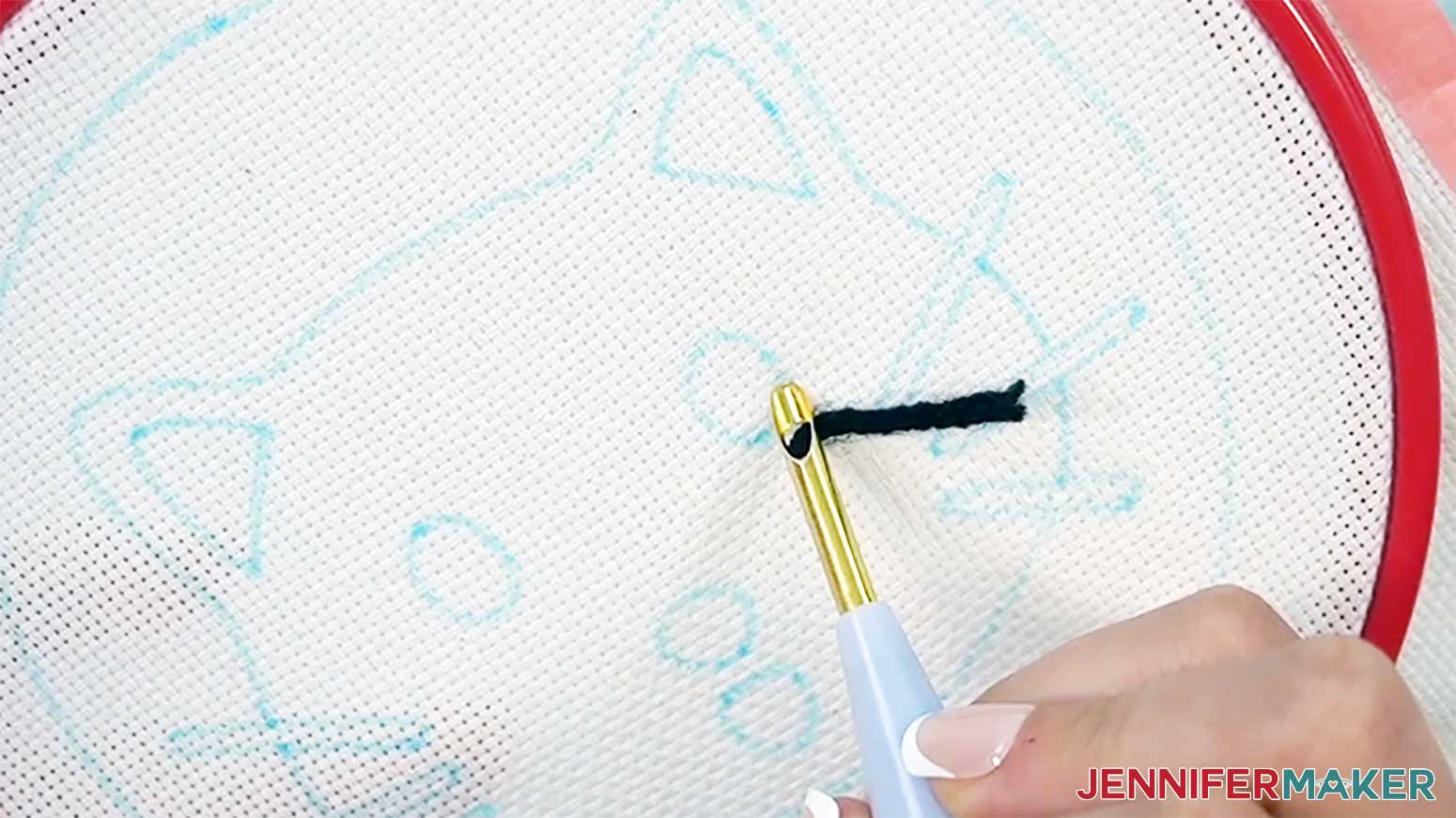 The point of the needle is angled toward the direction of the stitches and the yarn will trail behind to begin the first stitch of the punch needle design.