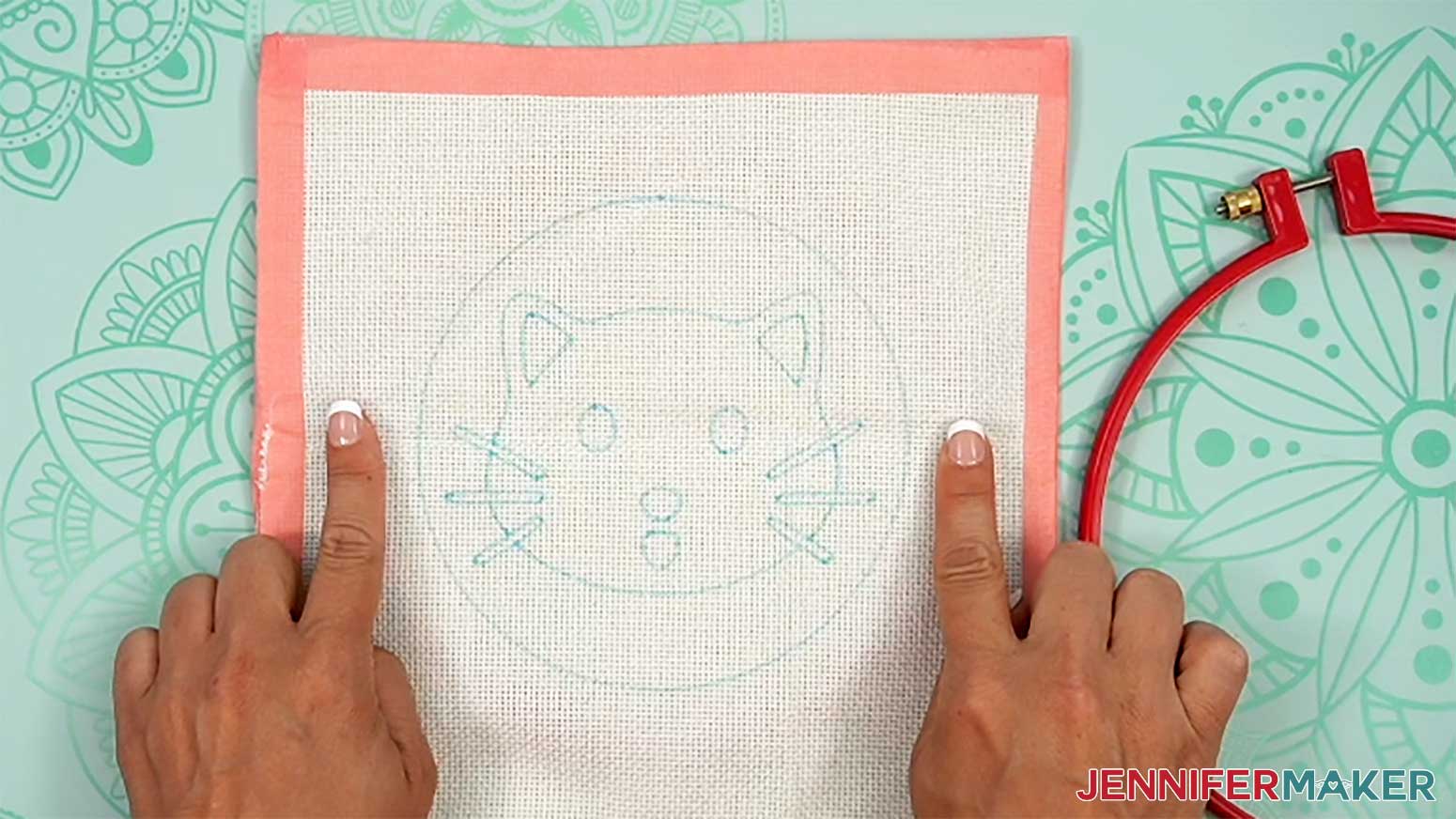 Center the inner hoop under the cloth with the punch needle design.