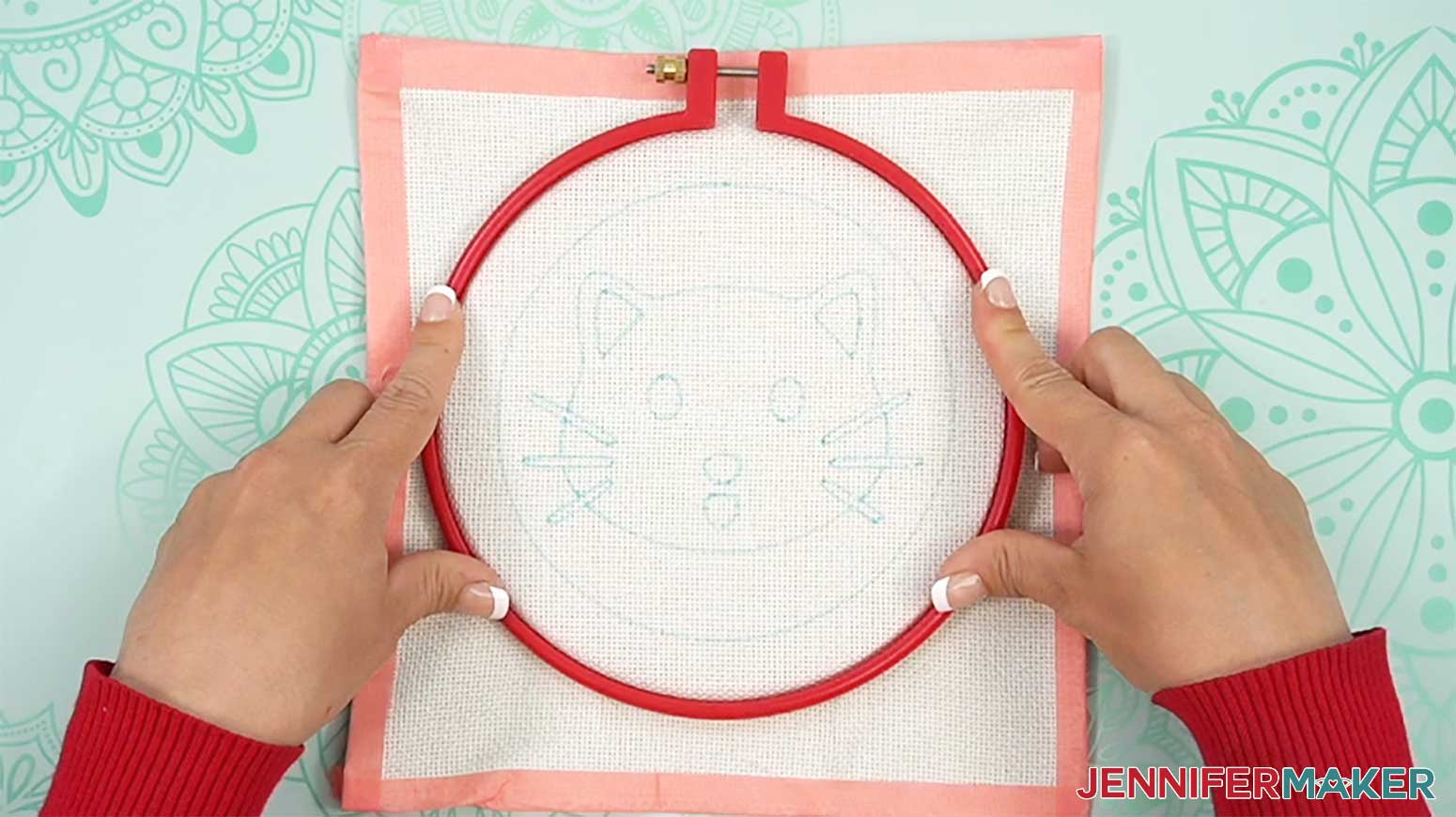 Push the outer hoop over the inner hoop to sandwich the punch needle design material into place.
