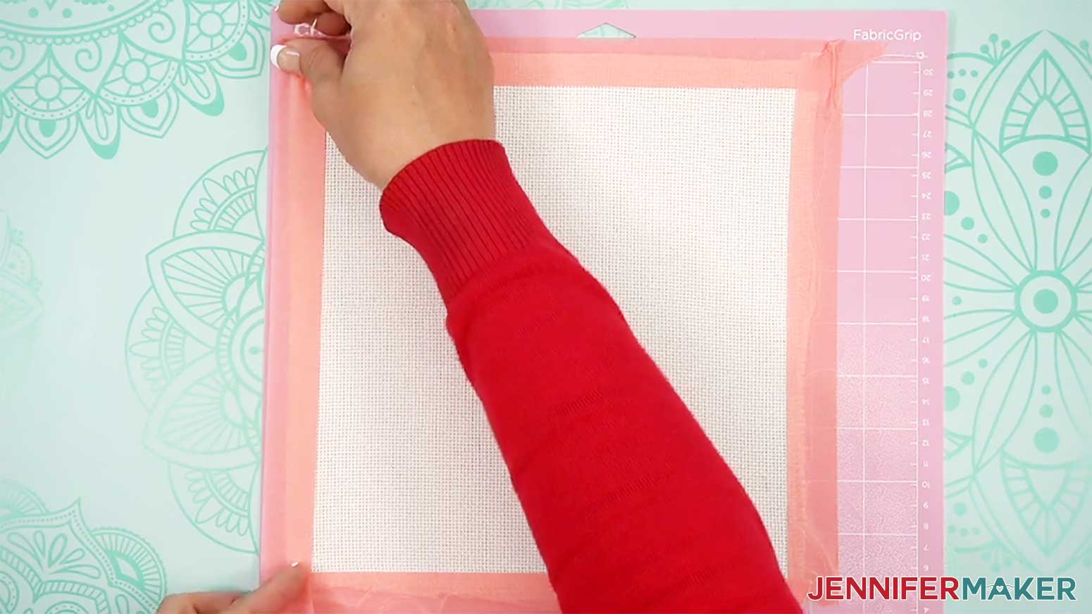 Place painter tape on all four edges of the fabric to prevent the edges from fraying and catching in the machine when drawing the punch needle design.