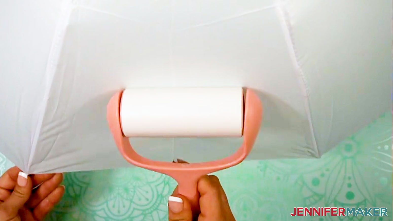 Lint roll the panel of the sublimation umbrella to prepare for pressing the design.