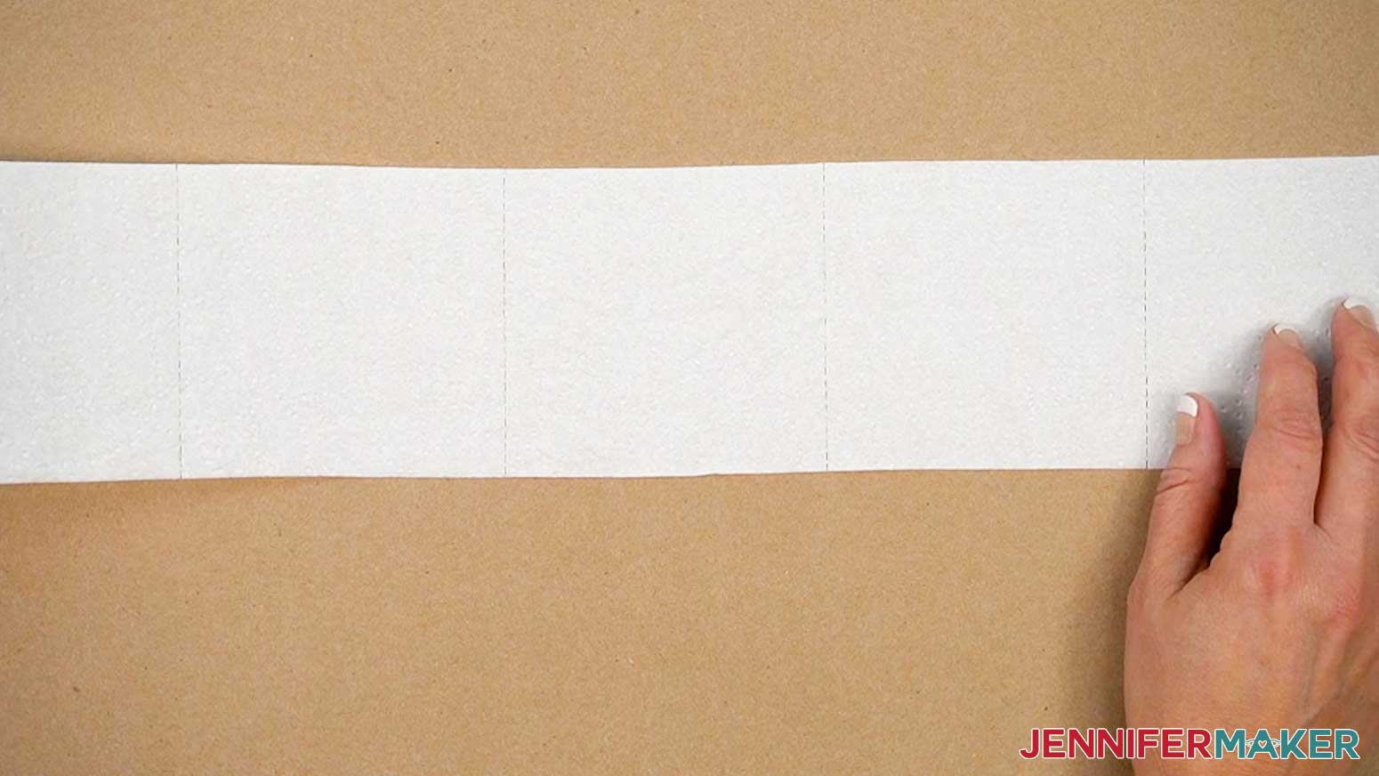 Roll out a length of toilet paper onto a piece of butcher paper.