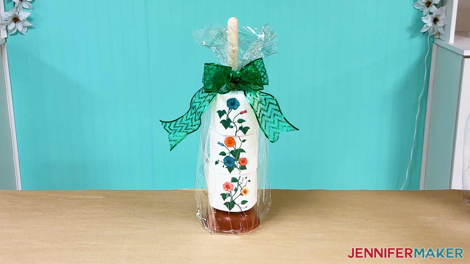 Package the plunger and sublimation toilet paper stack inside a cellophane back and add a festive bow for gift giving.
