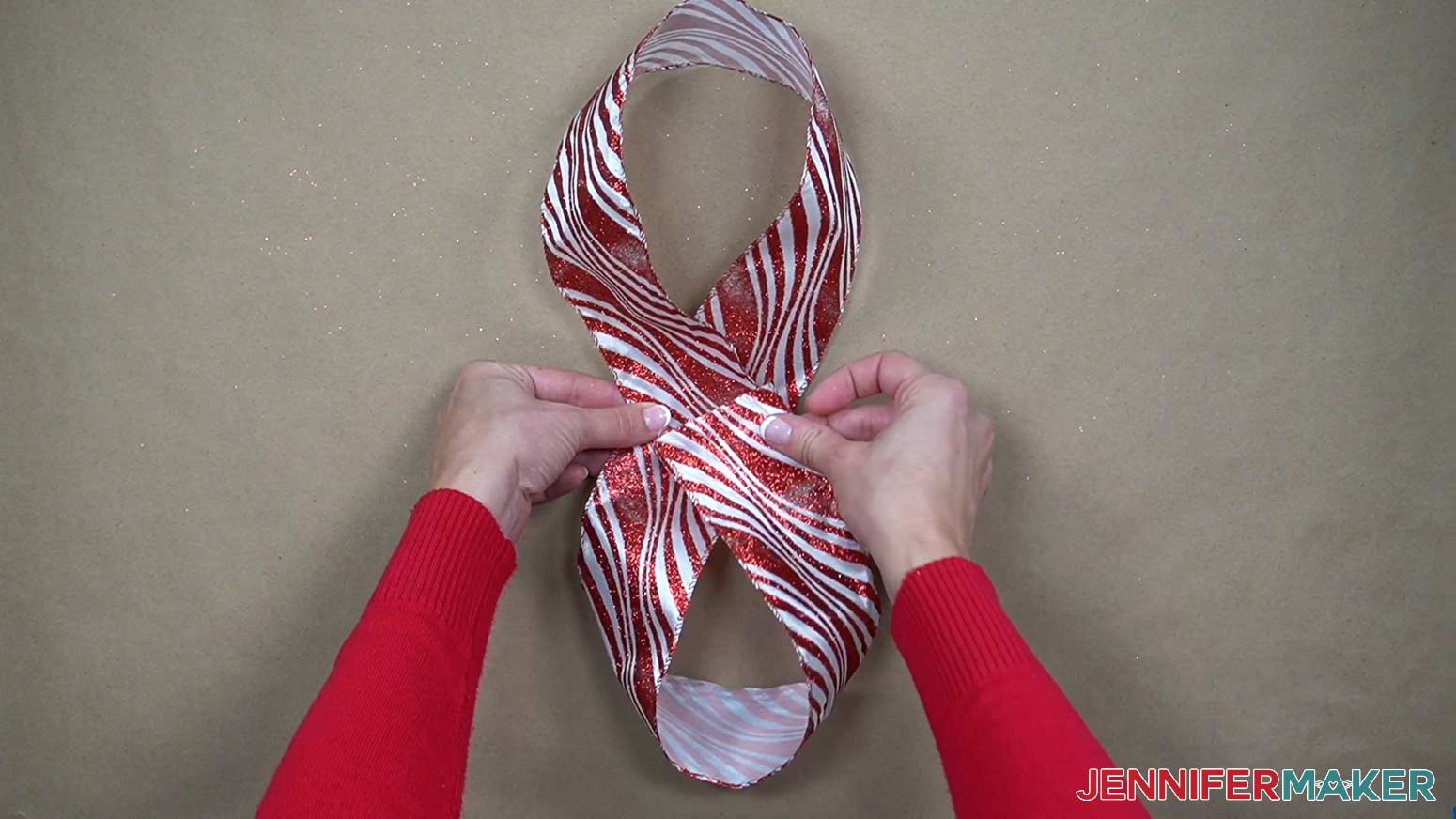 Make two loops in the ribbon and connect the ends together to form a figure eight.