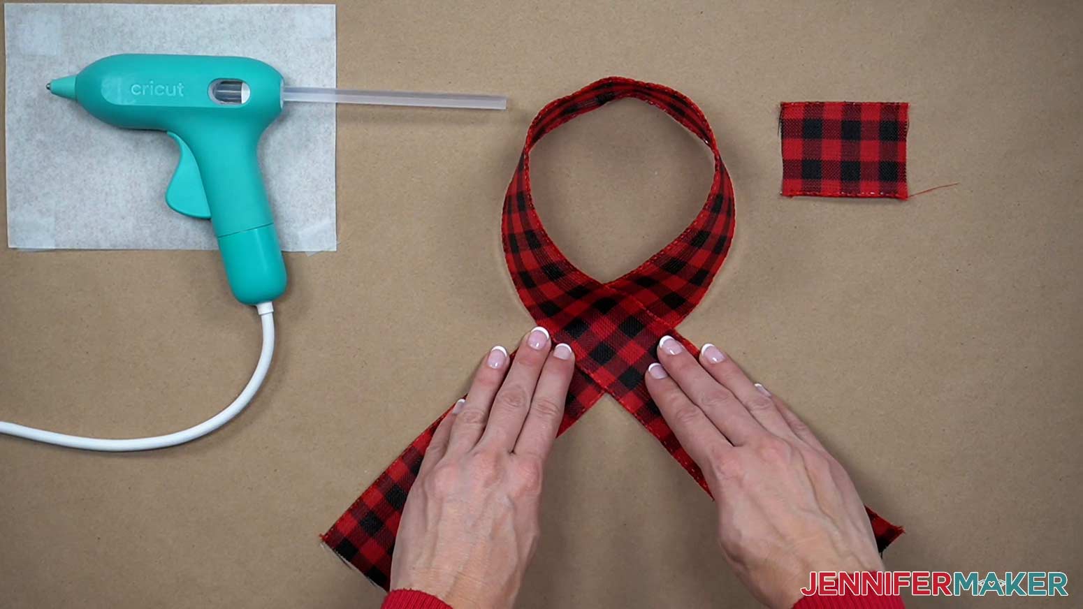 Make a loop with the ribbon so the ribbon crosses itself where the loop is the same size as the end pieces below where the ribbon crosses itself.