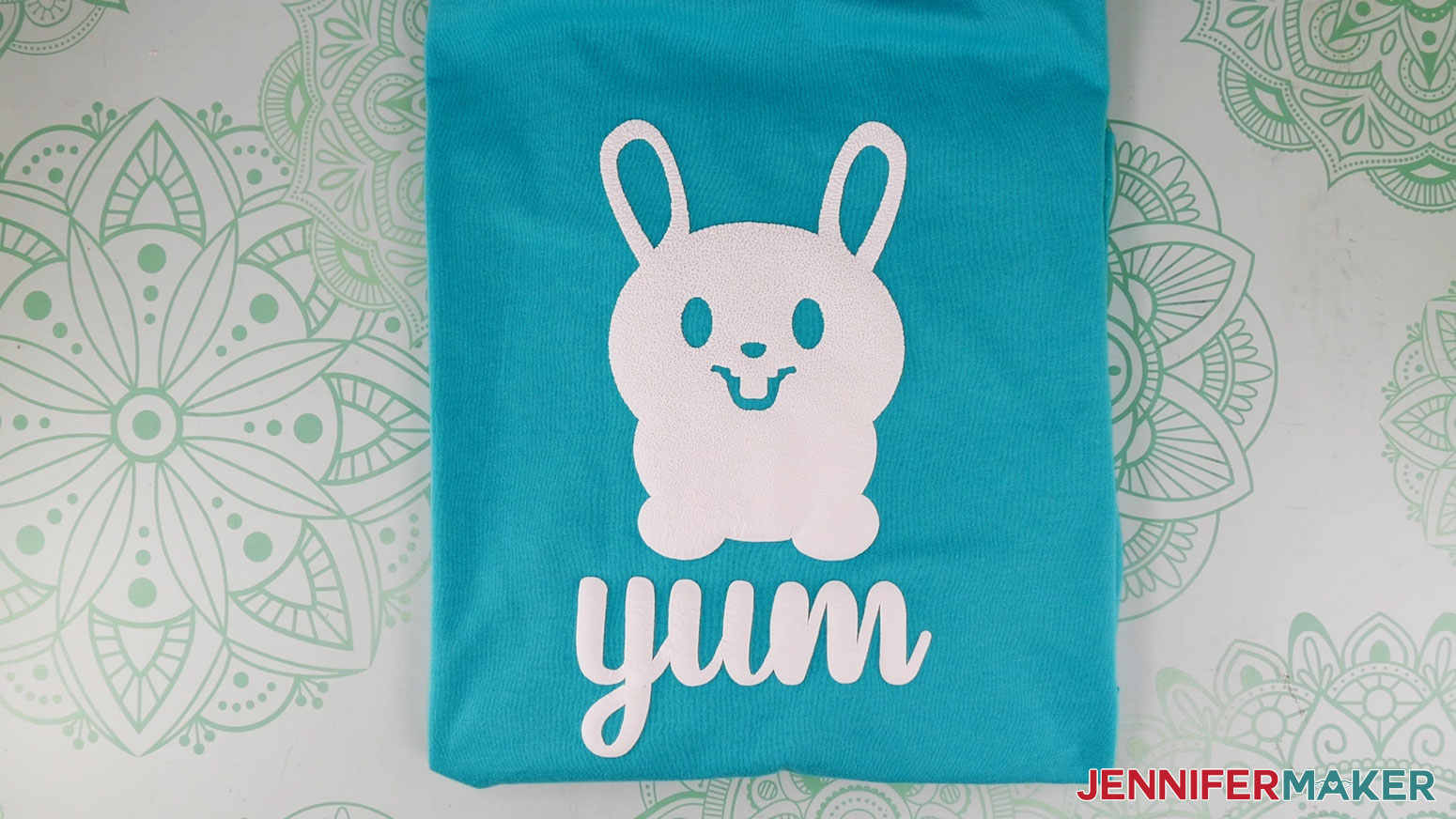 Learn how to use puff vinyl! Cute bunny puff design on a turquoise T-shirt.