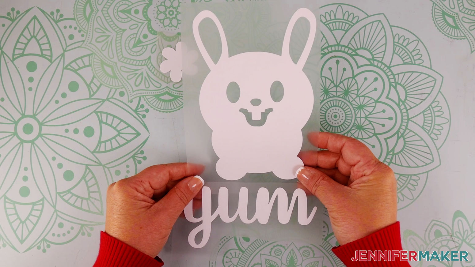 how to use puff vinyl white bunny and test flower with the word yum fully weeded on a teal cricut mat