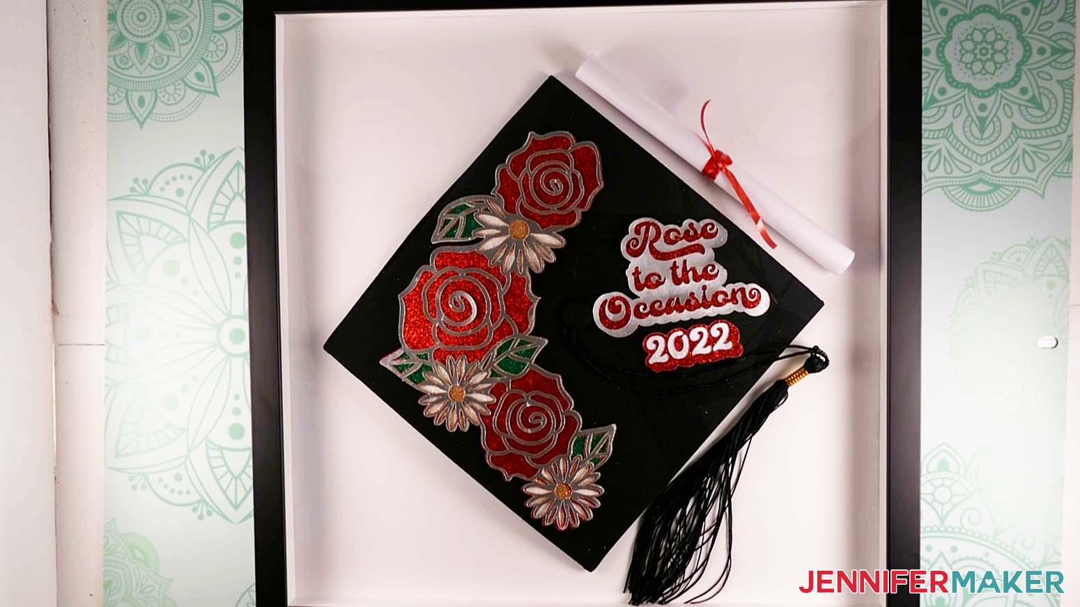 A shadow box with an assembled Rose Graduation Cap and diploma displayed inside