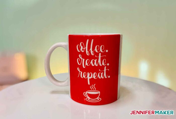 A red Cricut Infusible Ink mug made on a Cricut Mug Press