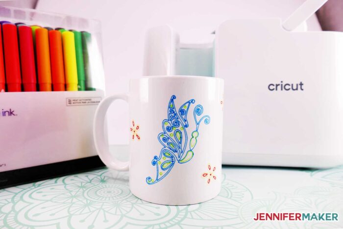 Pretty butterfly on an Infusible Ink pen mug made with the Cricut Mug Press and Cricut Infusible Ink pens