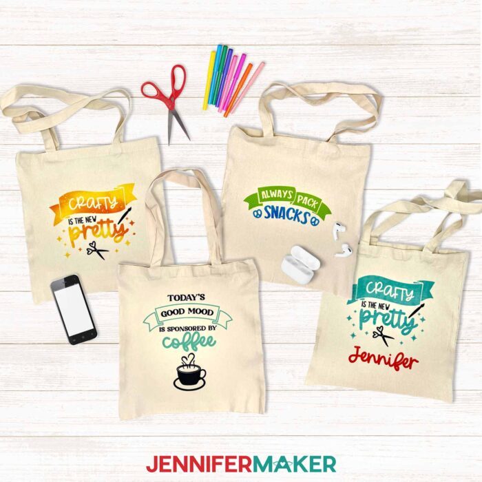 Four tote bags with colorful Infusible Ink designs. Can You Layer Infusible Ink? This tutorial can show you how