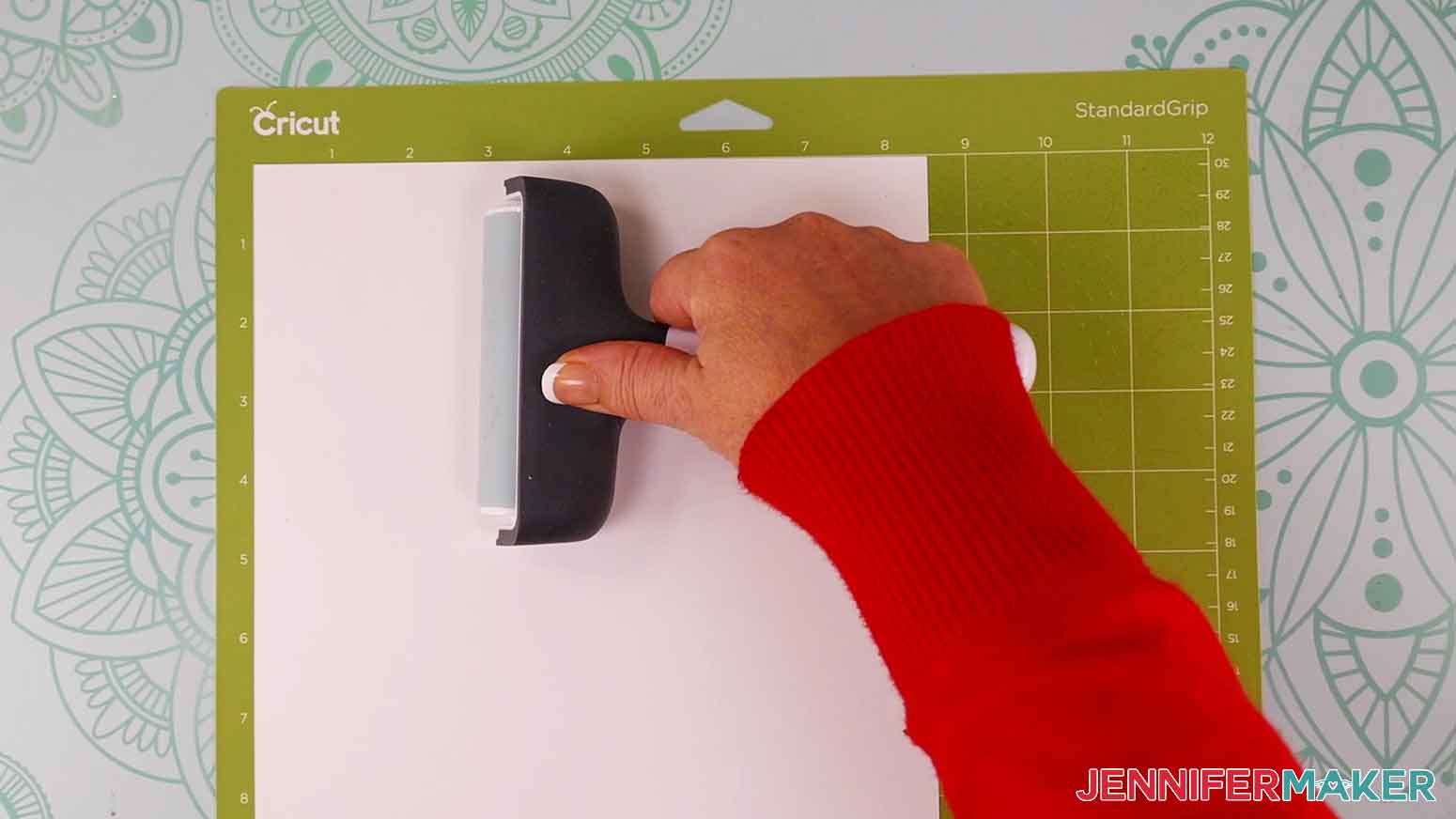 Use a brayer to best adhere the cardstock to the green machine mat.