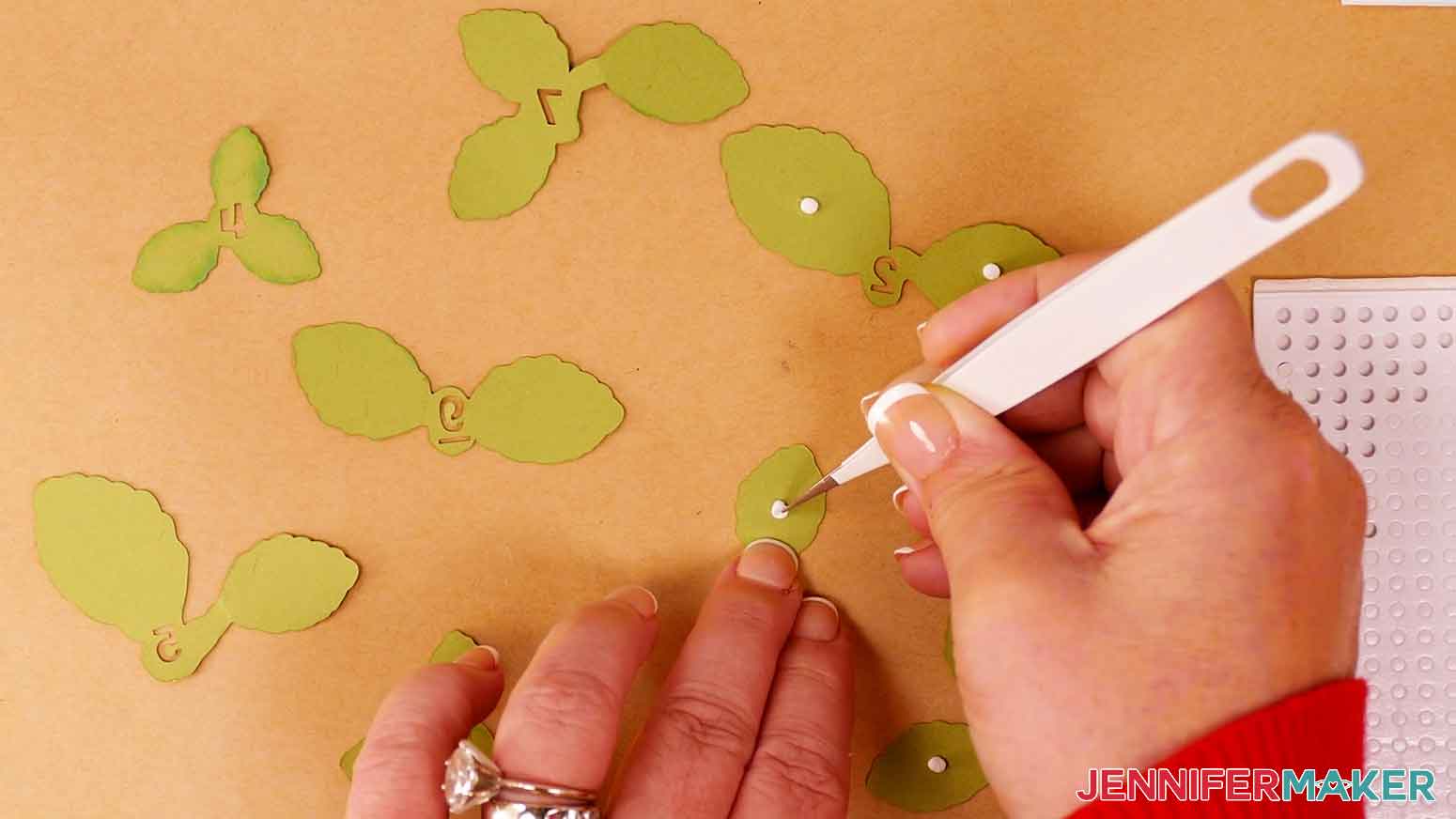Place foam adhesive on the back side of the light green leaf layer for the cherry blossom leaves.