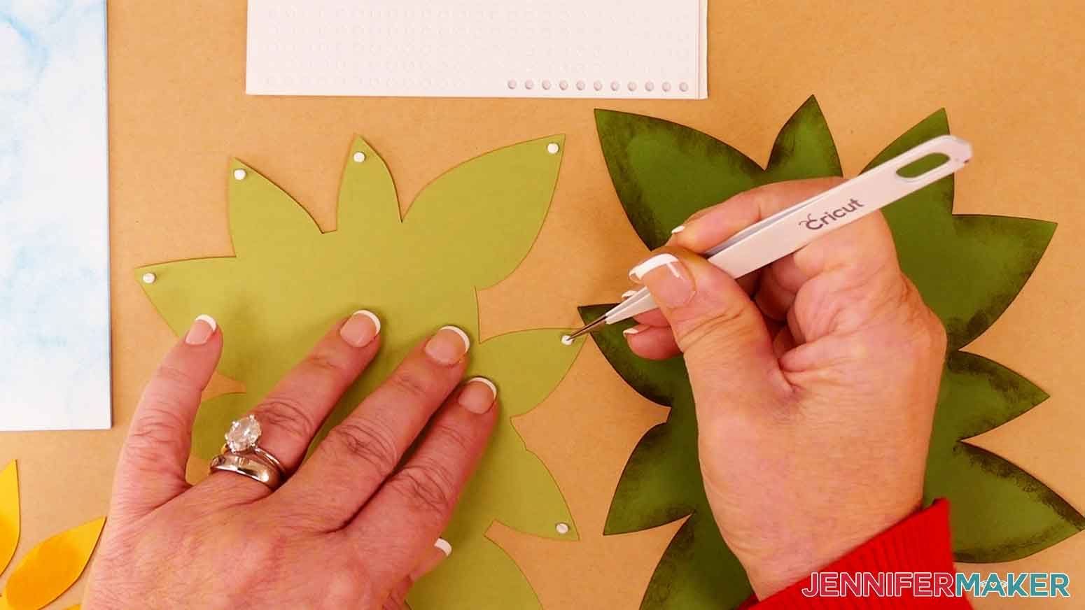 Apply foam adhesive to the back side of the light green top leaf layer for the sunflower design.