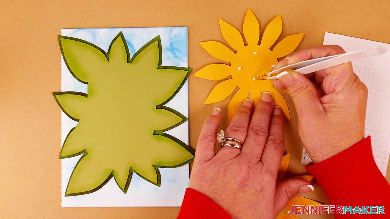 Apply foam adhesive to the back center section of the top sunflower petal layer.