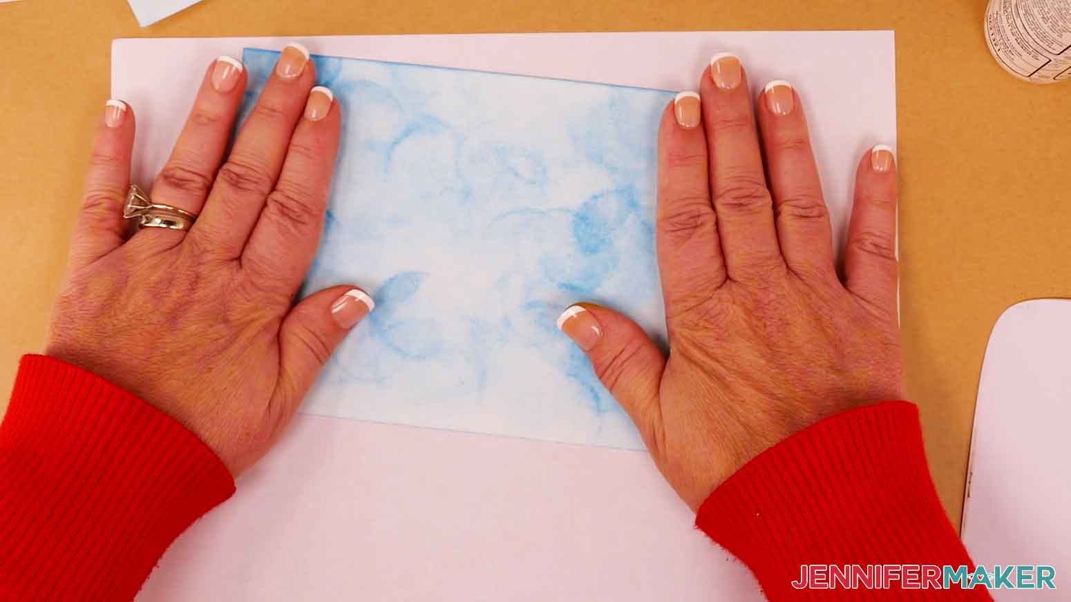 Apply craft glue to the back of the sky layer and attach it to the front of the folded blank card.