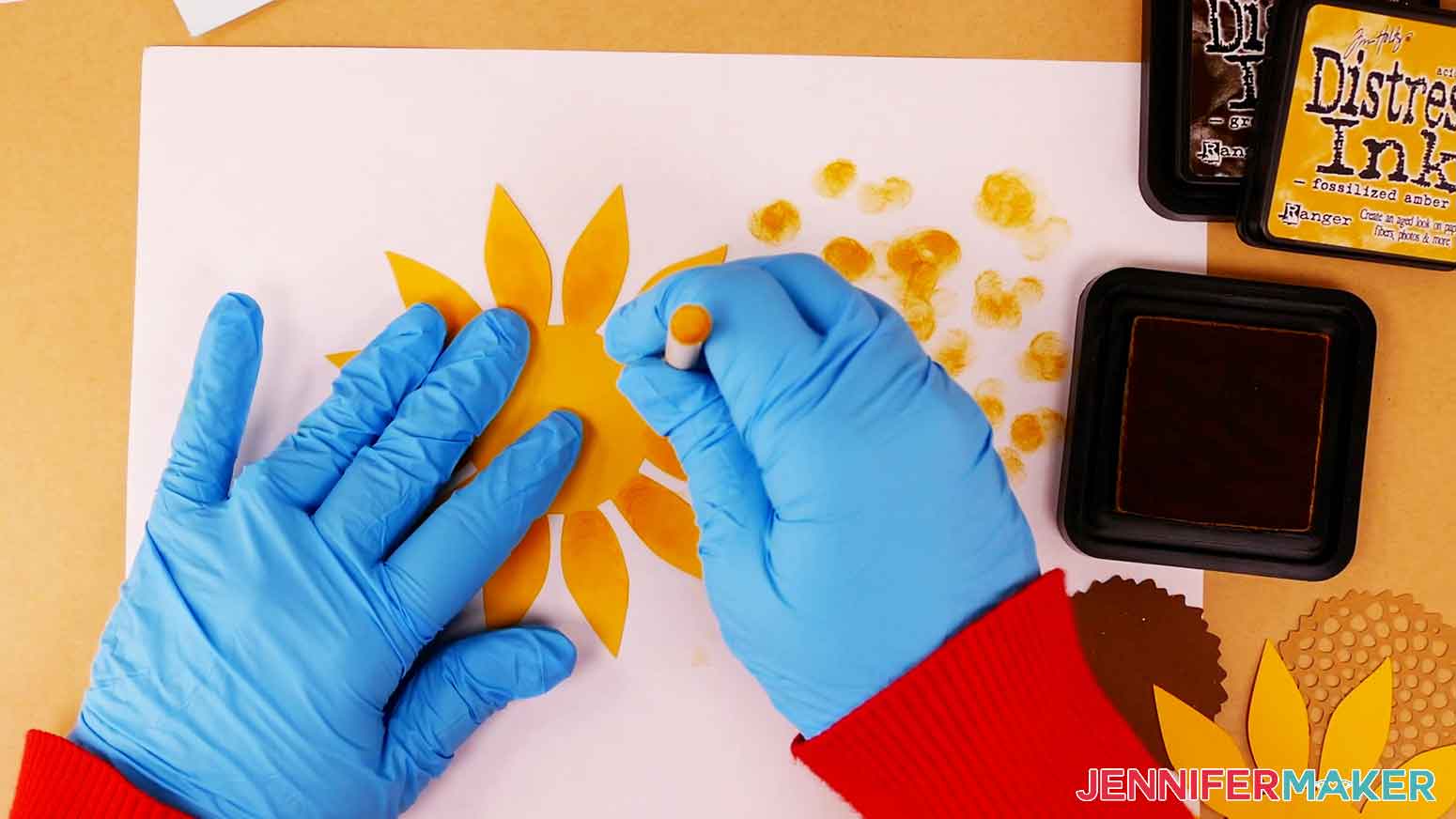 Blend a yellow shade of distress ink from the center of the petals towards the tip.