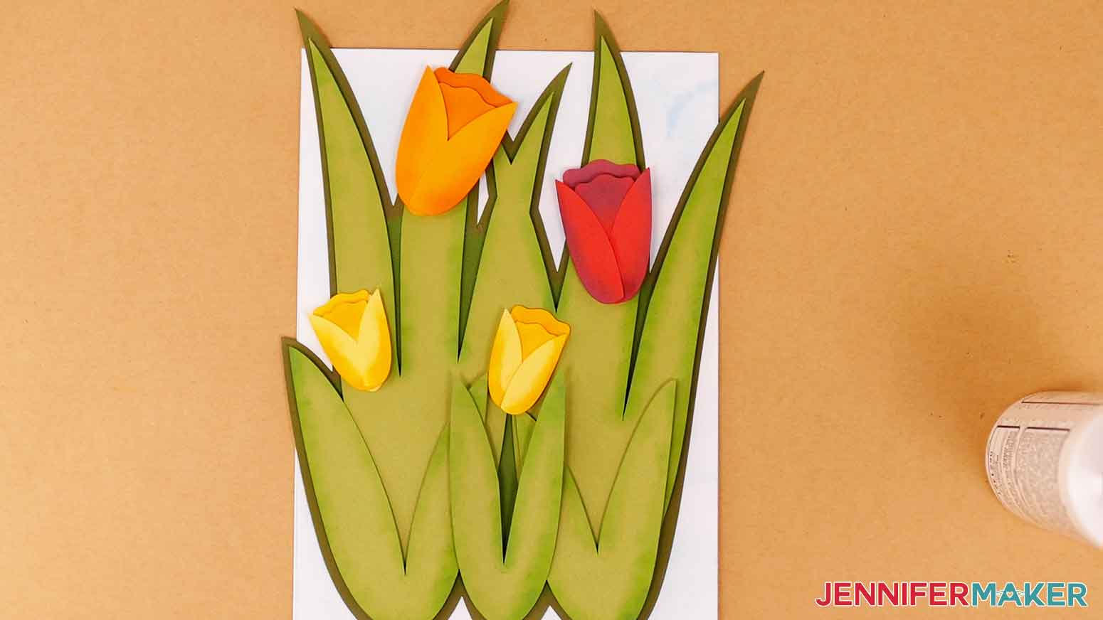 Tulip flowers arranges on leaves for visual placement.