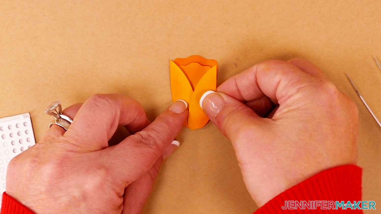 Apply foam adhesive to the back of the side petals and press them in to place.