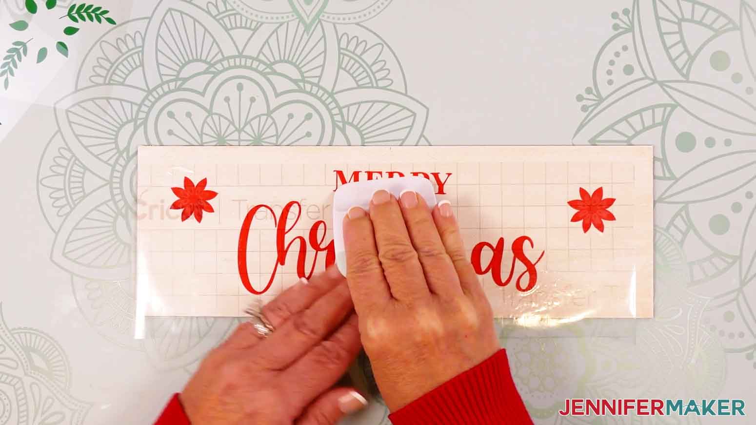 Use a scraper tool to burnish the vinyl on to the wood panel.