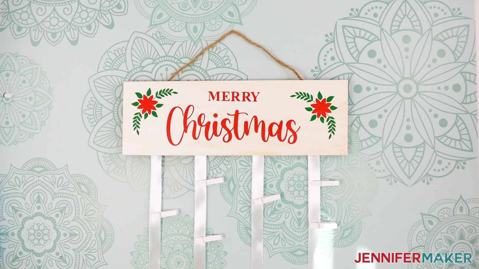 Finished ribbon card hanger with the Merry Christmas design displayed.
