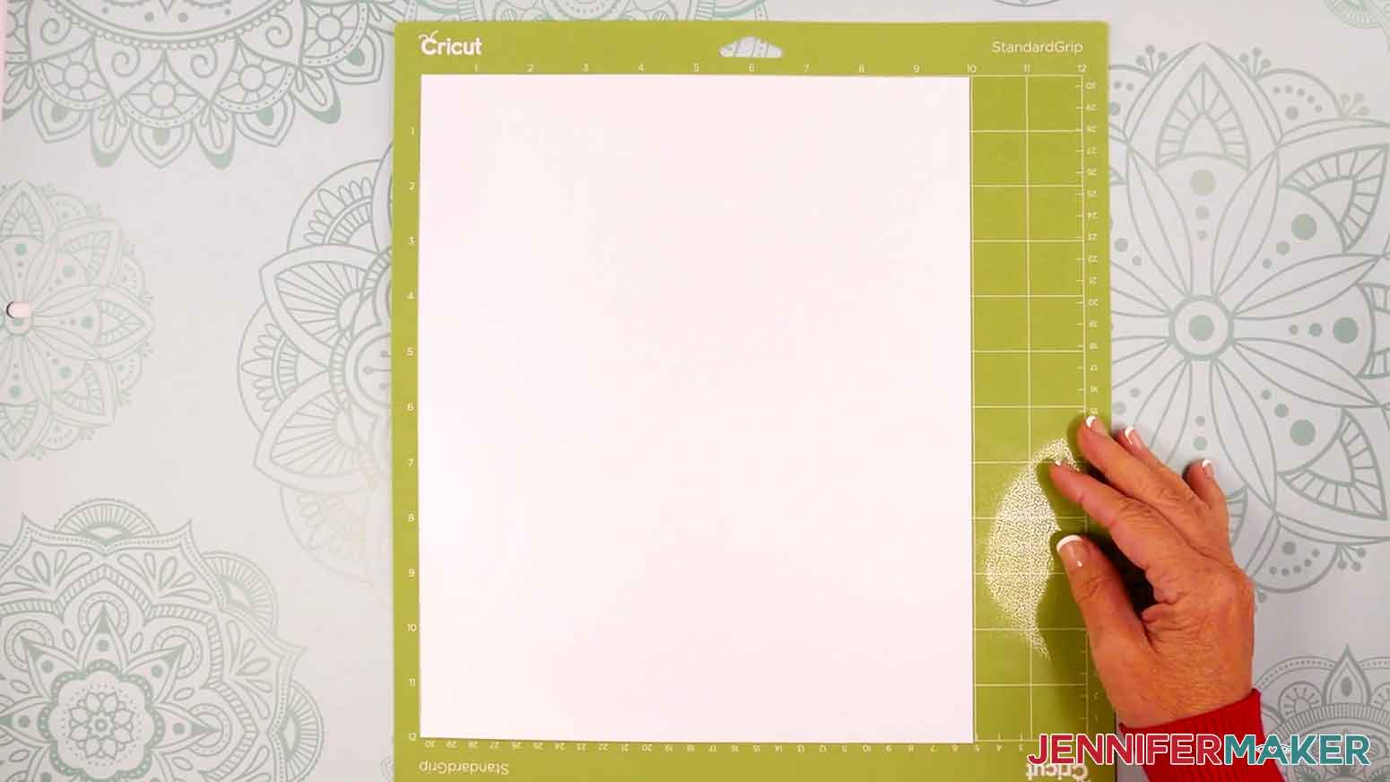Place the white permanent vinyl in a green machine mat.